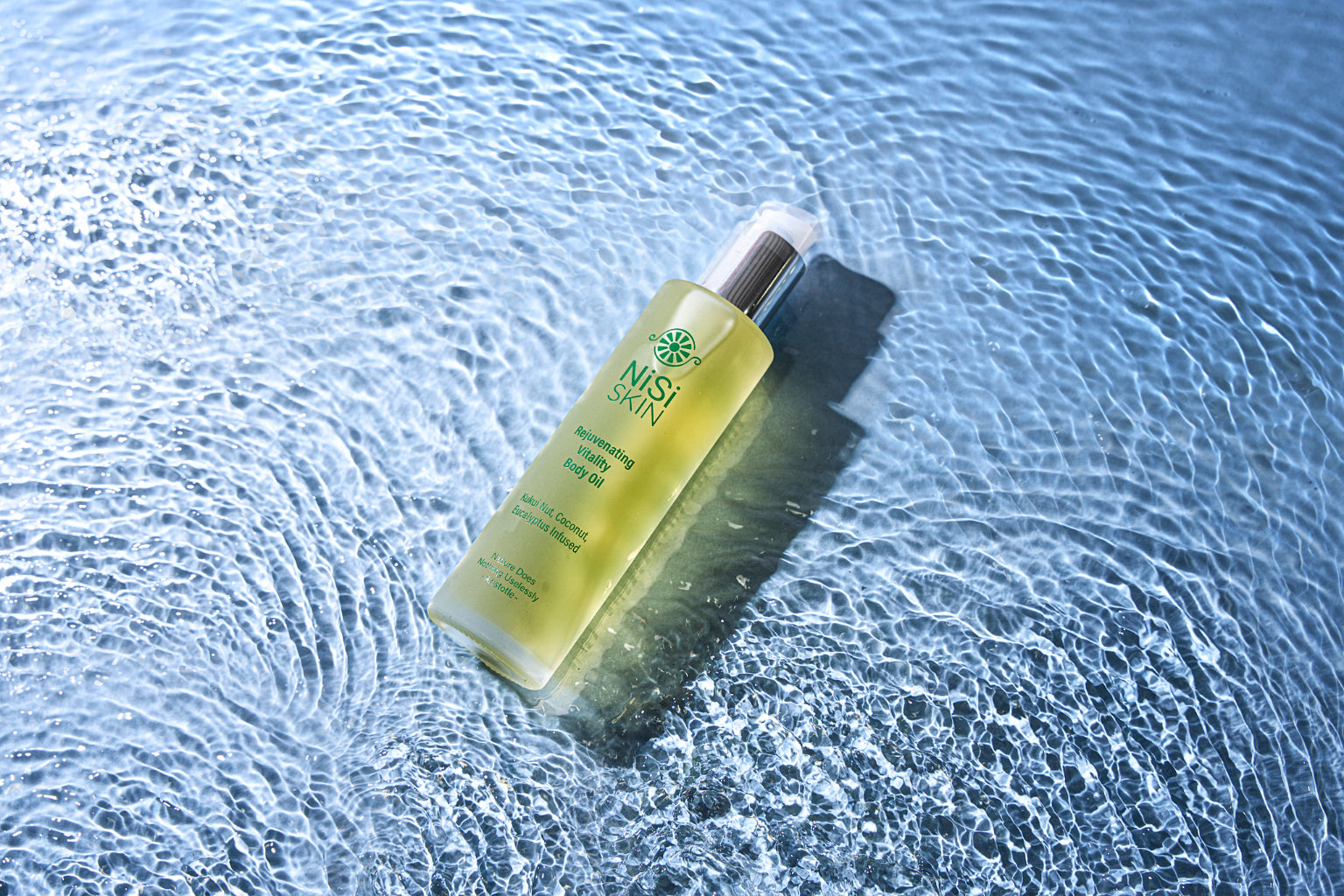Nisi-skin-Rejuvenating-Vitality-Body-Oil-golden-liquid-in-water.jpg