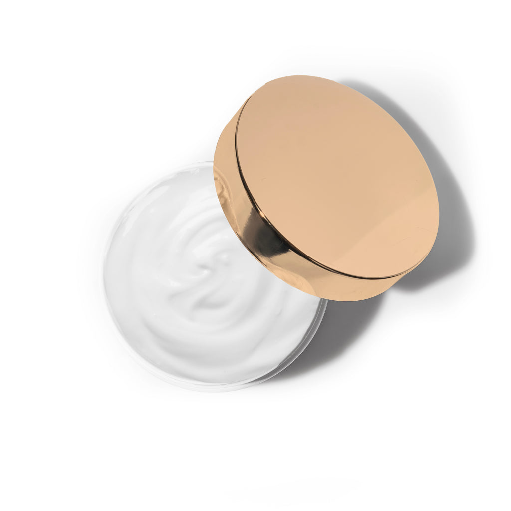 Nisi Skin Rose Ambra Body Creme rose gold metal lid with an open jar and supple white body creme 