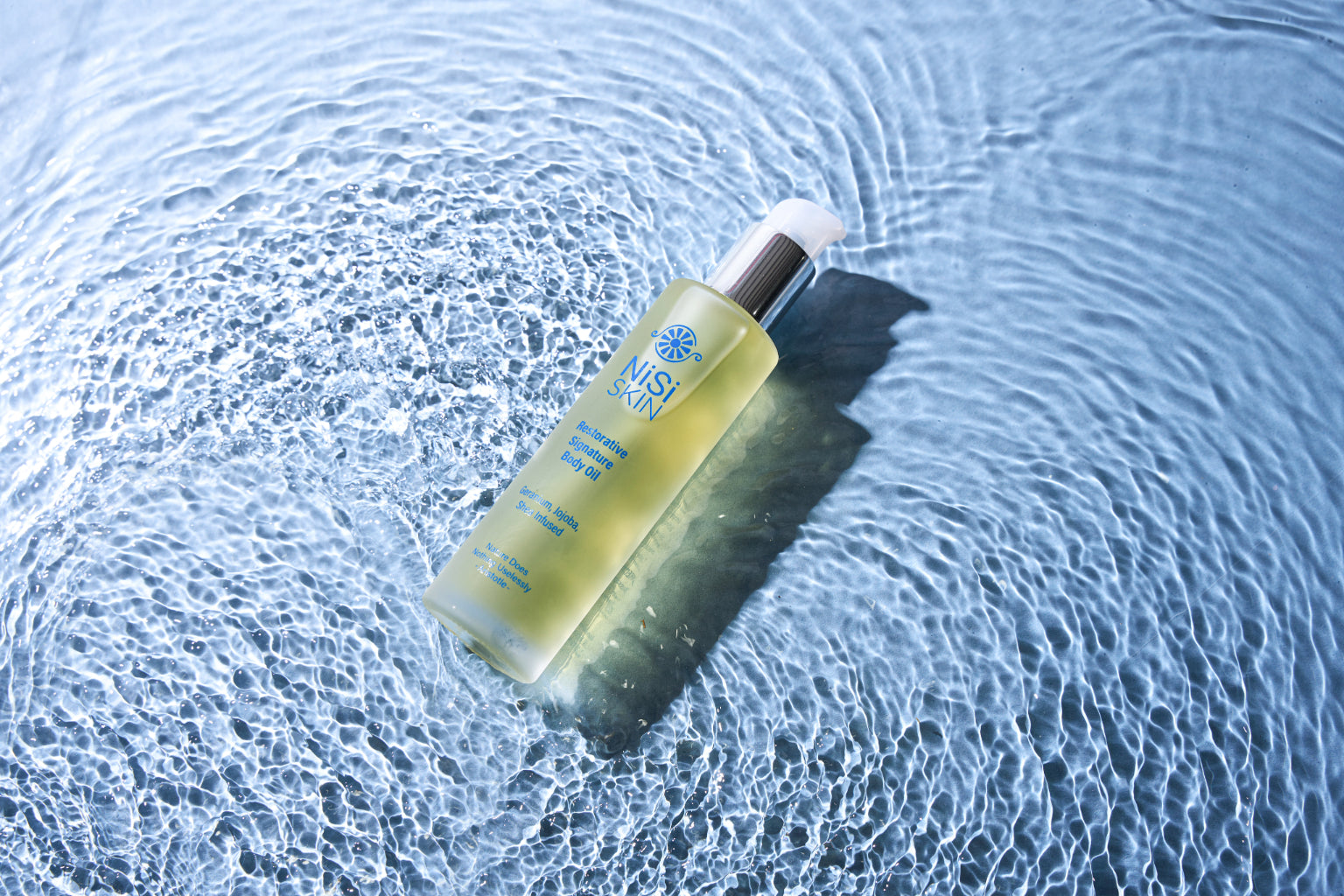 nisi-skin-Restorative-Signature-Body-oil-golden-liquid-geranium-in-water_e2e3f387-9ce6-4d86-abb4-17db3d13e9d4.jpg